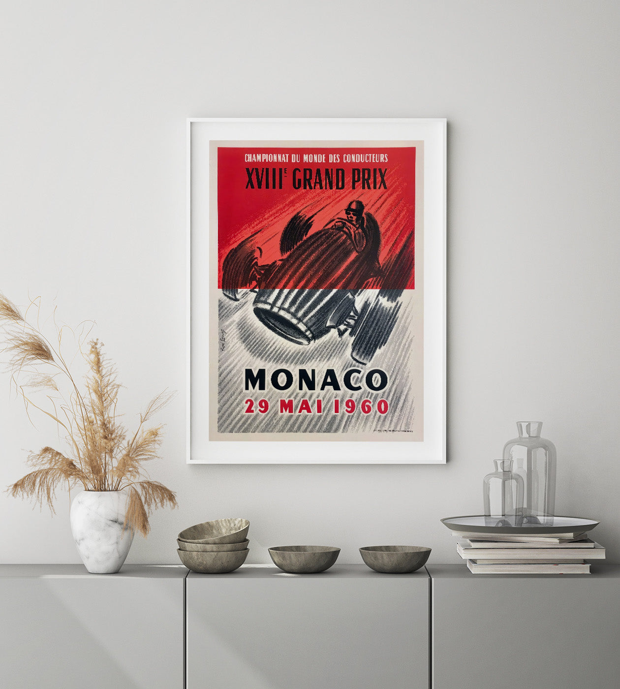 Illustrated poster from 1960 showing a red race car against a red and grey background and with text in black and red.