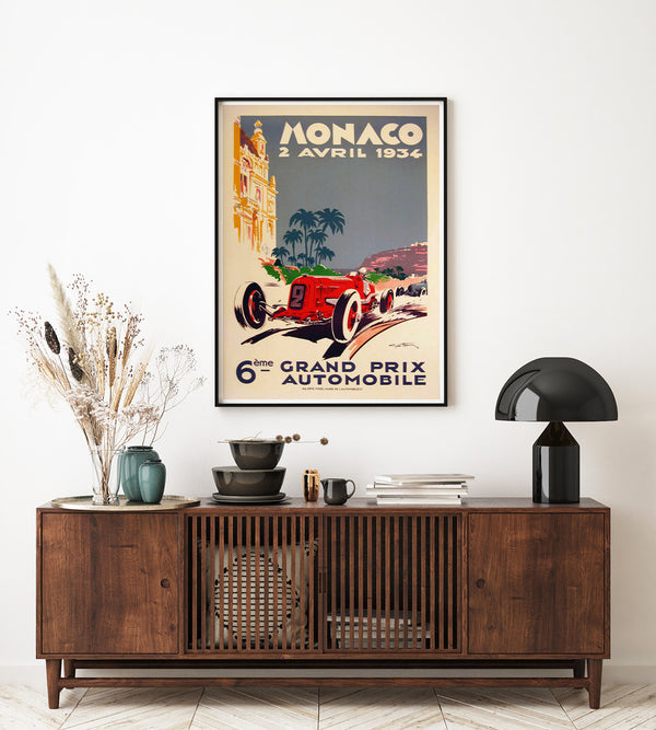 Classic vintage poster from 1934 showing a red car with blue sky and palm trees in the background