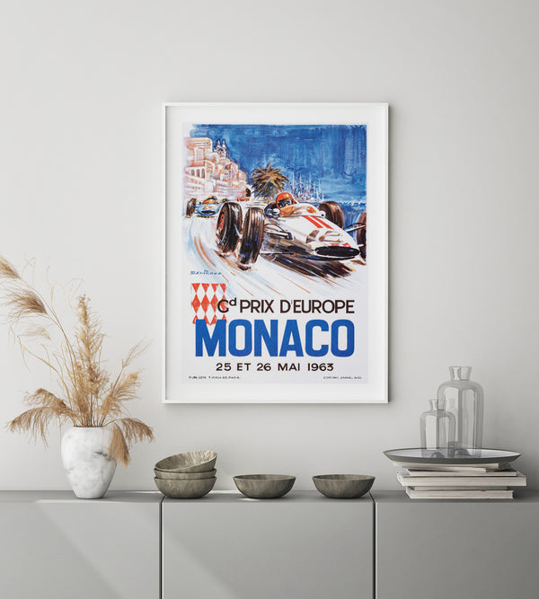white and red race car against a city background and with text in blue and black.
