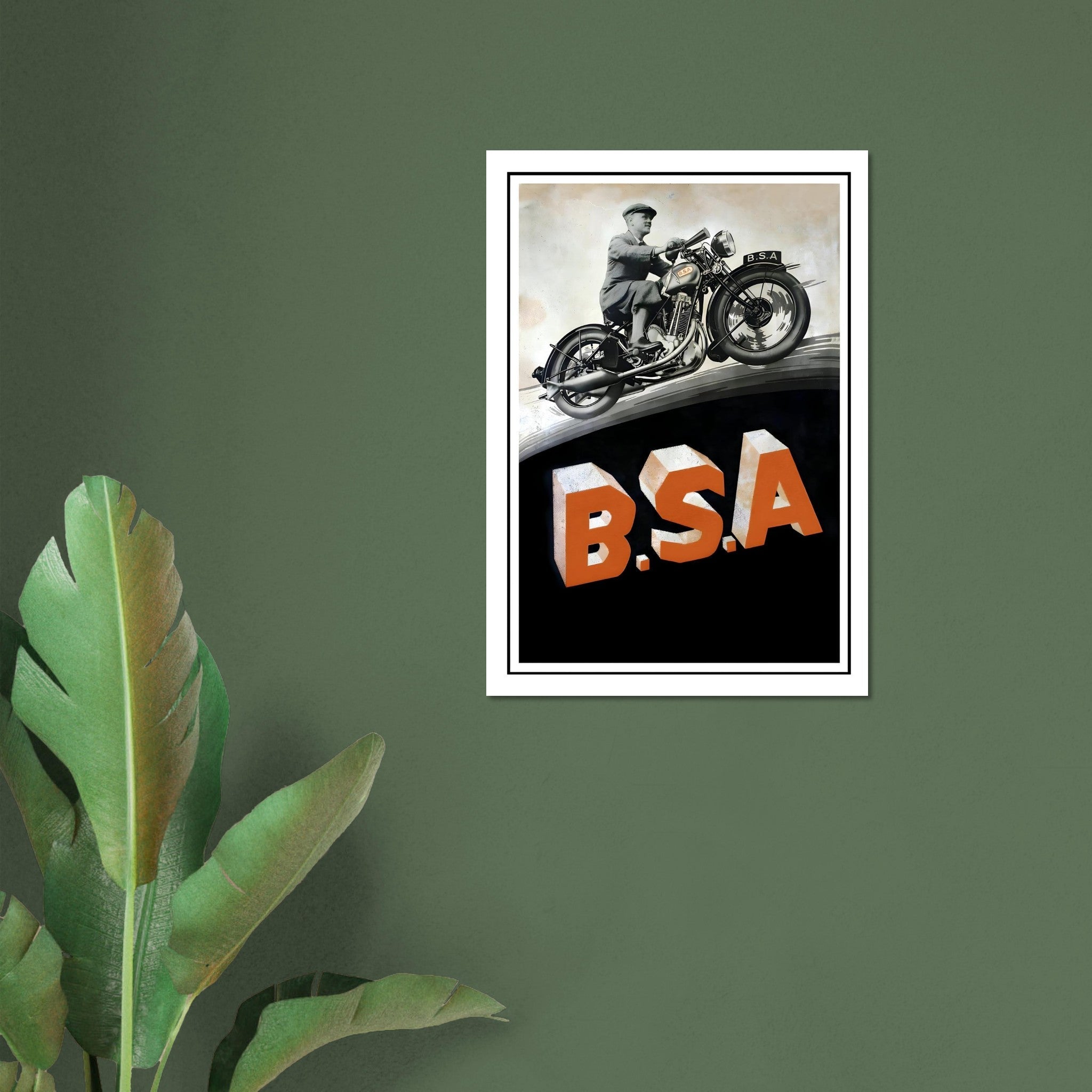 Classic BSA motorcycle poster featuring a man on a motorcycle above bold B.S.A. letters.